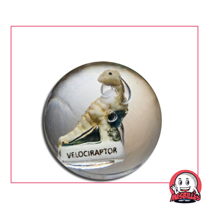 Bille Incrustation Velociraptor 35 mm – dinosaure beige miniature dans une bille transparente