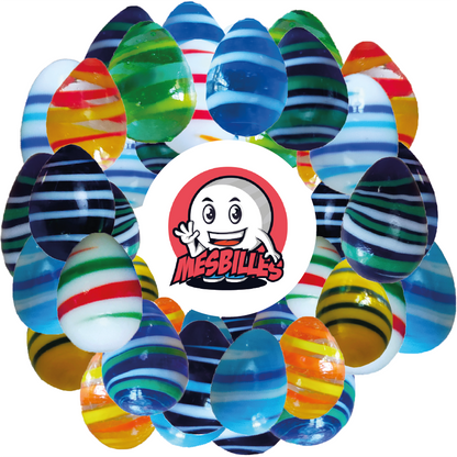 Immagine della mascotte MesBilles circondata da Biglie Ovoide MesBilles, forma non convenzionale, vetro blu intenso striato di bianco e blu, 25 mm Biglie Ovoide MesBilles, forma non convenzionale, vetro blu intenso striato di bianco e blu, 25 mm